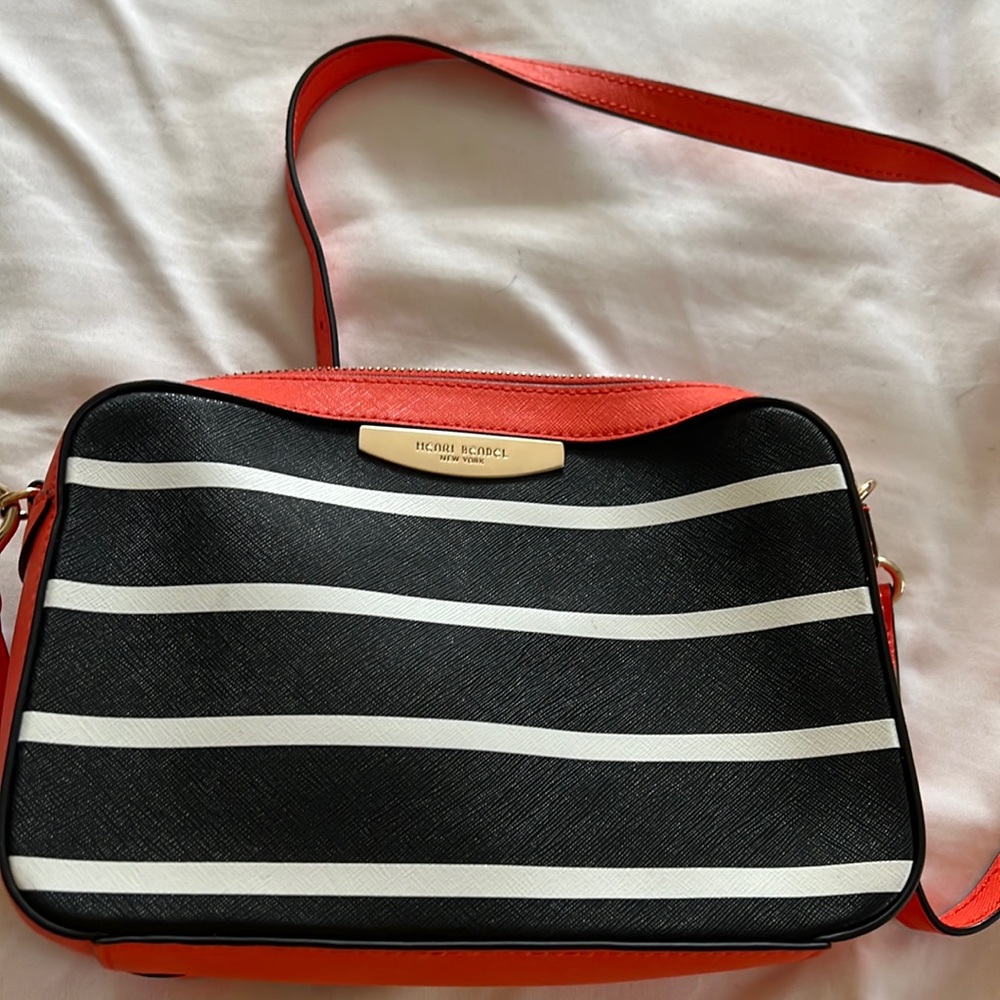 Brand new Henri Bendel crossbody in black, orange and white.